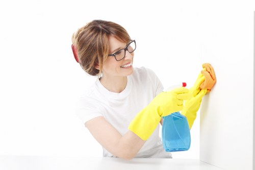 Cleaning technician applying stain treatment to a carpet
